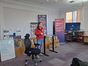 Someone stood talking to a crowd